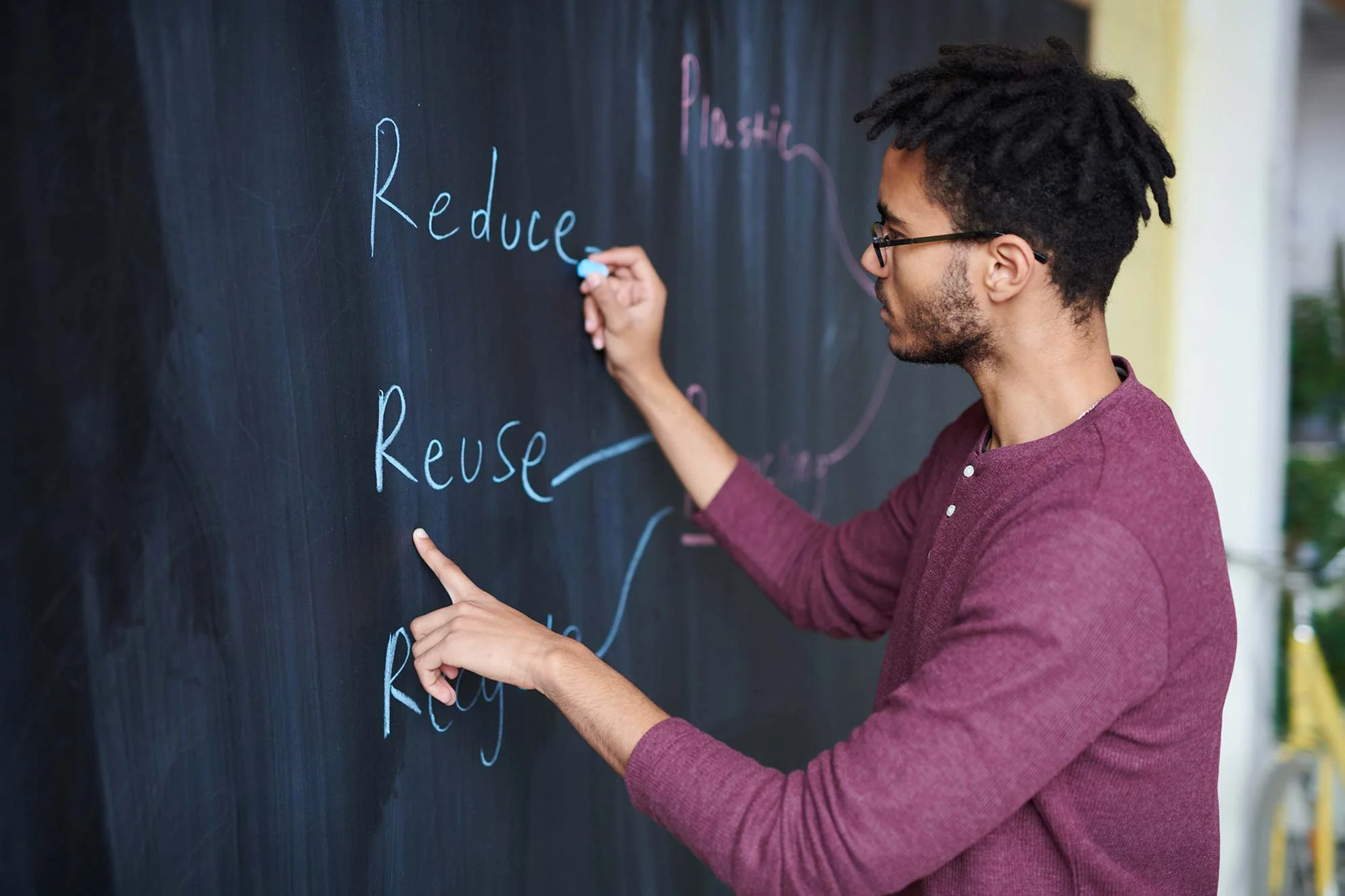 Man Drawing on Chalkboard Man Drawing on Chalkboard